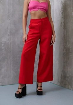 NEVER FULLY DRESSED TROUSERS DYNASTY - Stoffhose - Red
